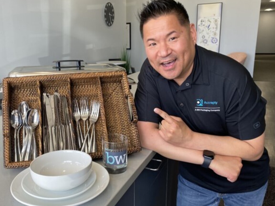 Jason Rebeck posing with reusable tableware